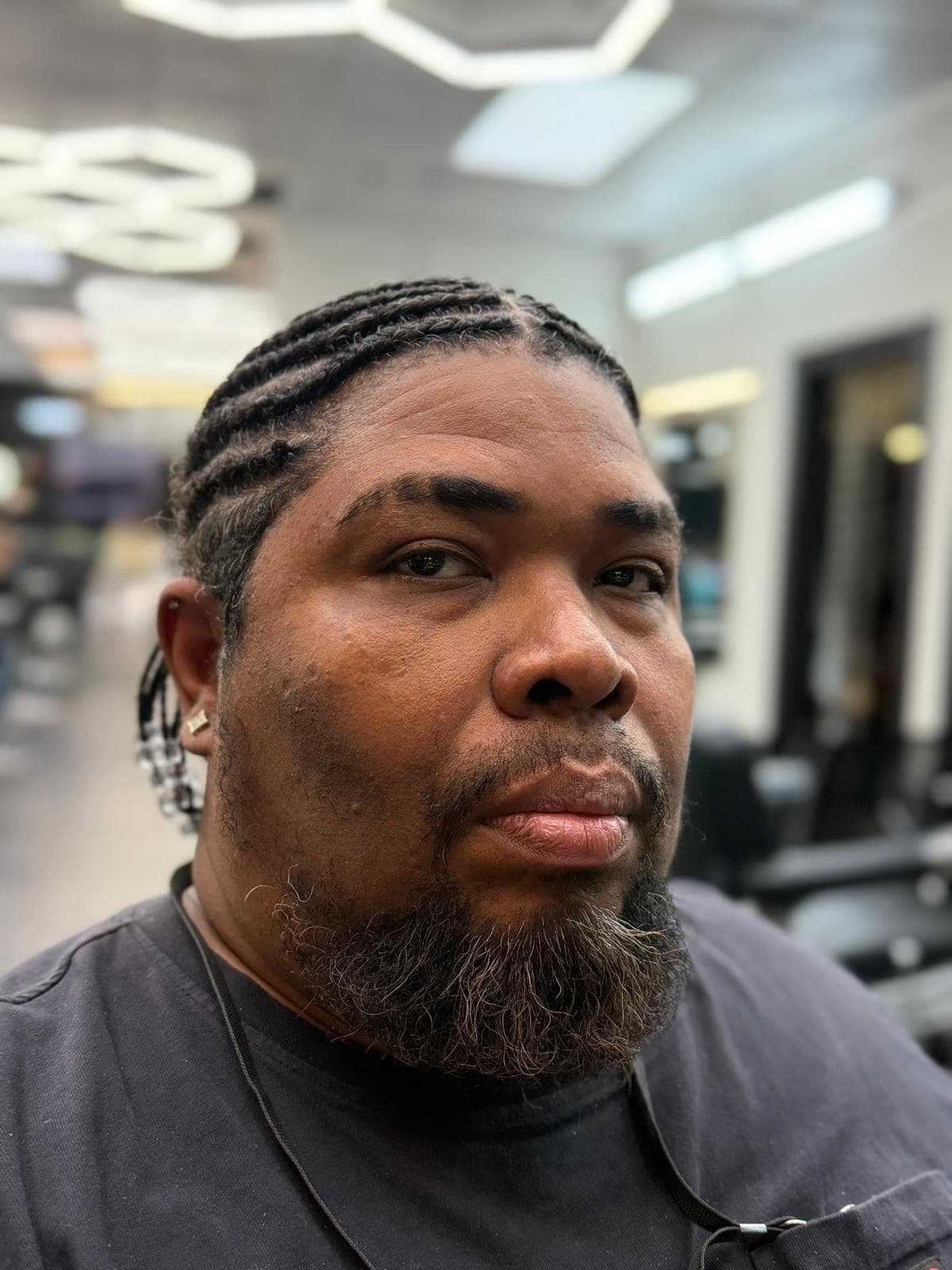 El Chino - barber at The Dominicans Barbershop